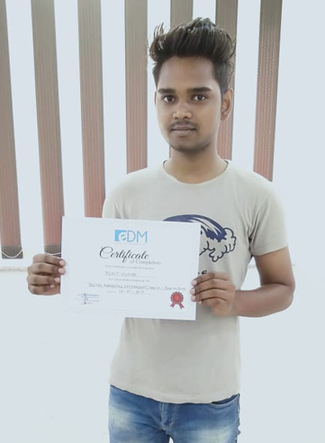 Student holding their E Digital Marketers certificate of completion